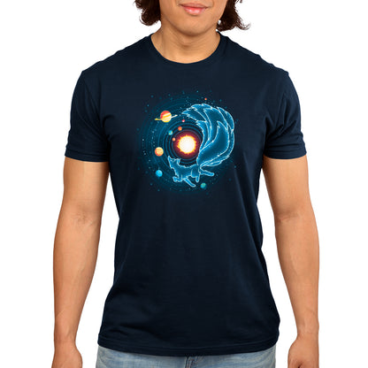A man wearing a navy blue Kitsune Constellation t-shirt with an image of a planet prances across the Milky Way. Brand: TeeTurtle