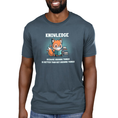 A fox wearing a denim blue Knowing Things T-shirt with the word "knowledge" printed on it, made by TeeTurtle.