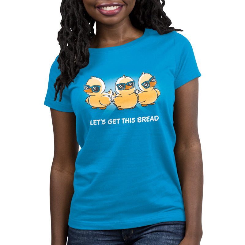 A cobalt blue women's t-shirt by TeeTurtle that says "Let's Get This Bread.