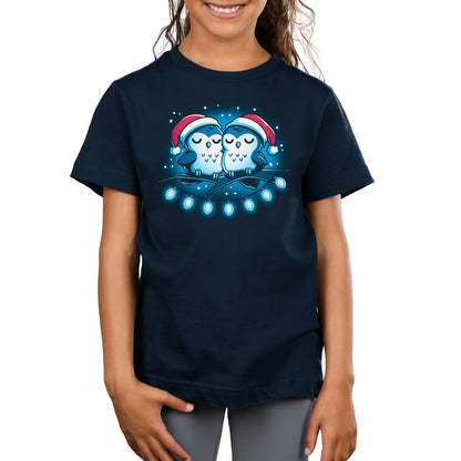 A girl wearing a comfortable navy Long Winter's Nap T-shirt with two owls on it from TeeTurtle.