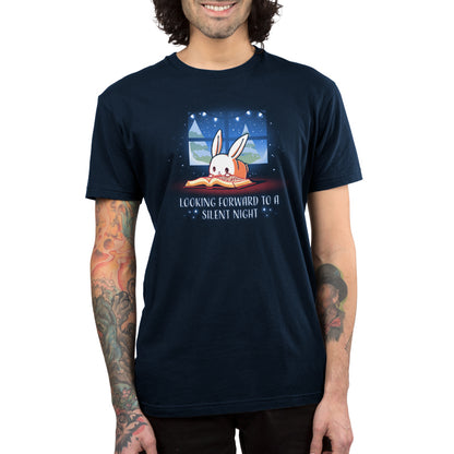 A man wearing the "Looking Forward to a Silent Night" TeeTurtle navy blue t-shirt.