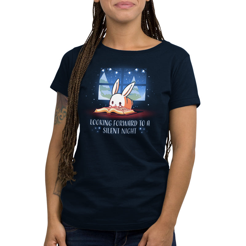 A woman wearing a navy blue "Looking Forward to a Silent Night" women's t-shirt by TeeTurtle with a rabbit on it.