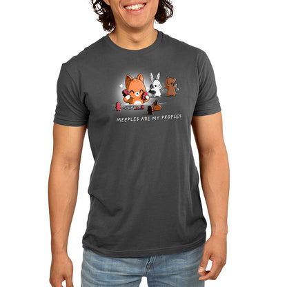 A man wearing a charcoal gray t-shirt with foxes on it from TeeTurtle called Meeples are My Peoples.