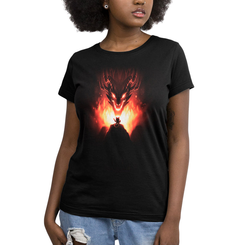 A woman wearing a black Mighty Warrior T-shirt by TeeTurtle with an image of a dragon in flames. The T-shirt is made of 100% super soft ringspun cotton, ensuring comfort and durability.