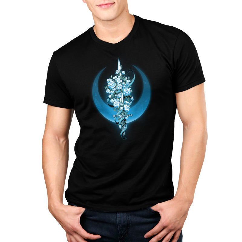 A man wearing a black t-shirt with blue flowers resembling TeeTurtle's Moonlit Blade of Roses.