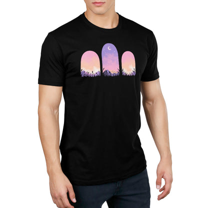 A man wearing a black T-shirt with a TeeTurtle Mystic Triptych beauty sunset in the background.