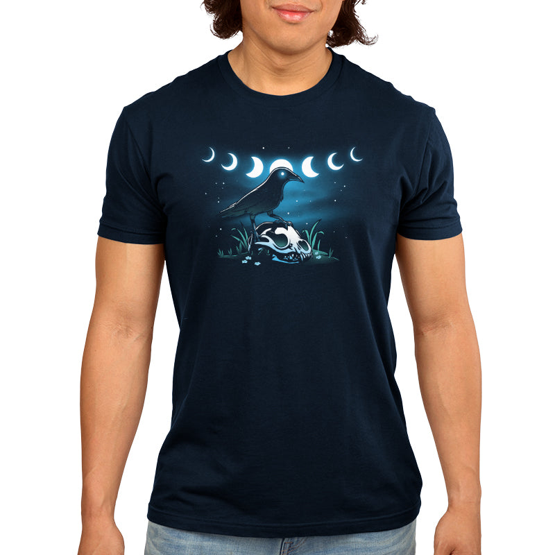 A man wearing a navy blue t-shirt with the Mystical Crow from TeeTurtle on it.