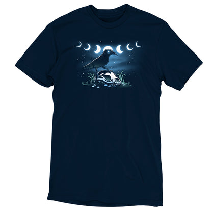 A TeeTurtle Mystical Crow perched on the moon with a crescent moon in the background, showcased on a navy blue t-shirt for ultimate comfort and fit.