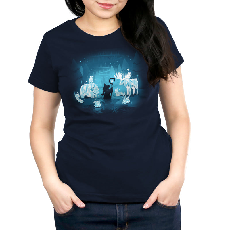 A navy blue women's Mystical Ice Sculptures t-shirt featuring an image of a woman and a dog in a winter wonderland from TeeTurtle.