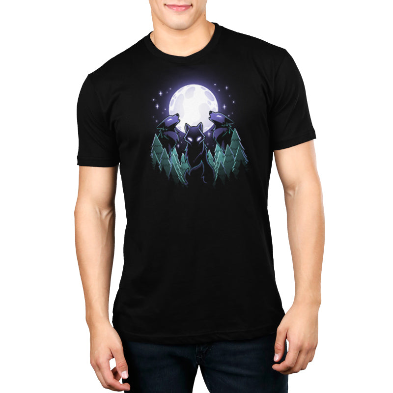 A man wearing a black t-shirt with the Mystical Moon by TeeTurtle on it.
