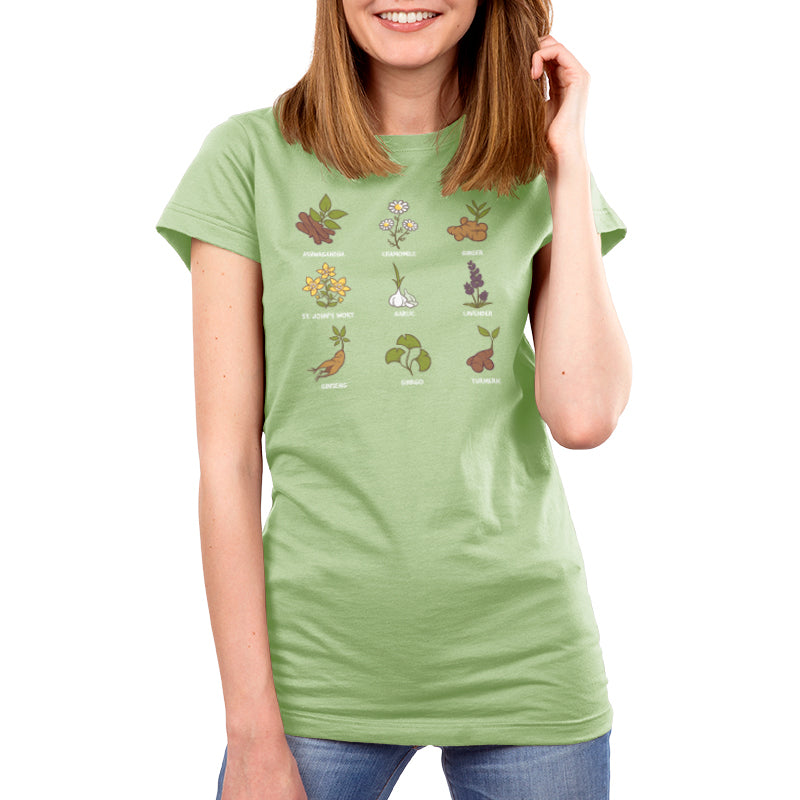 A women's green t-shirt featuring a variety of plants, including ginger and chamomile from Nature's Medicine, by TeeTurtle.