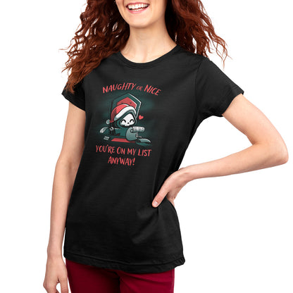 A woman wearing a black t-shirt with a santa hat featuring the Naughty or Nice (Grim Reaper) design by TeeTurtle.