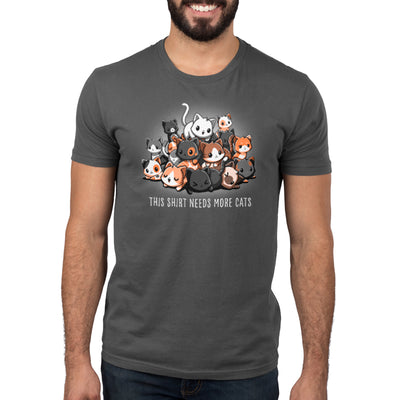 Premium Cotton T-shirt_TeeTurtle charcoal gray Needs More Cats apparel  featuring a pile of different colored cats with various expressions, caption reads "this shirt needs more cats".