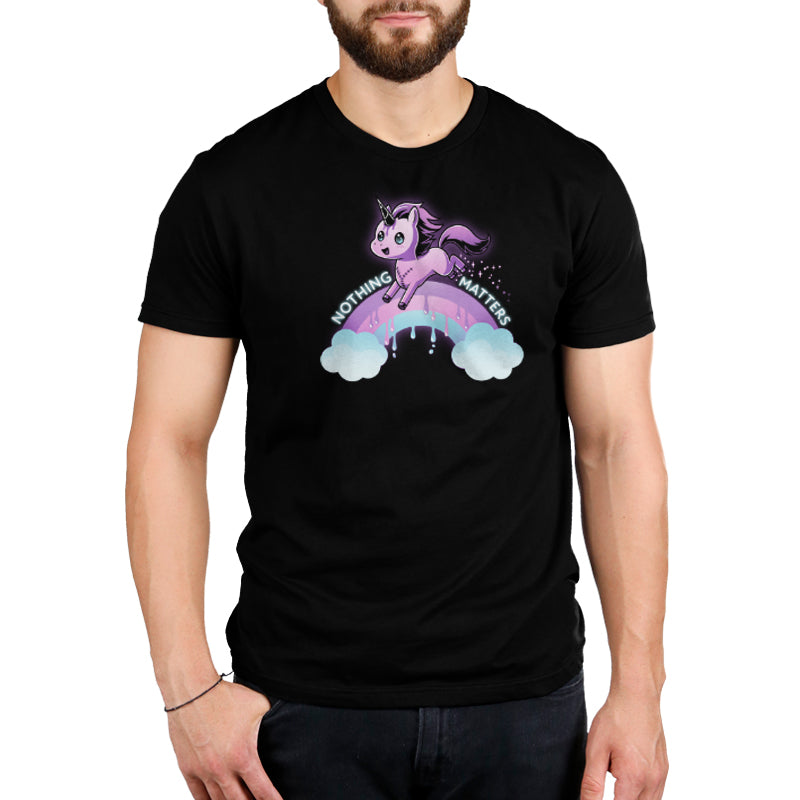 A man wearing a black t-shirt with a unicorn riding a rainbow and the words "TeeTurtle