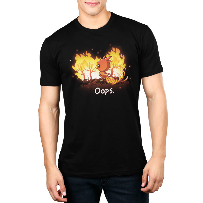 A man wearing a black t-shirt with an image of a pokemon on fire made with Oops by TeeTurtle.