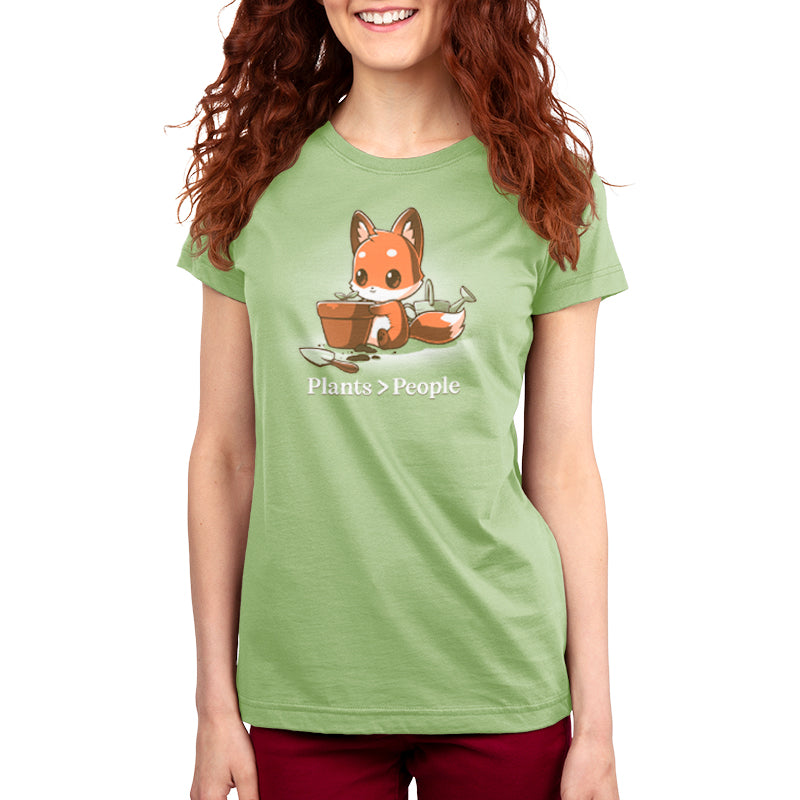A "Plants > People" sage green t-shirt featuring a fox in a pot, designed by TeeTurtle for personal preference.