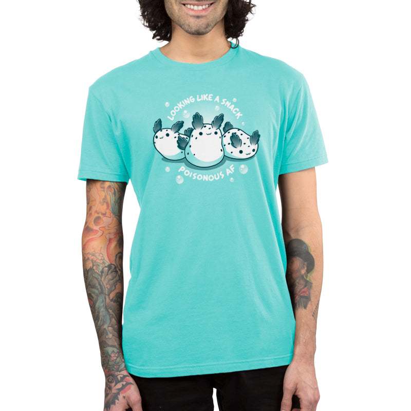 Premium Cotton T-shirt - A person wearing a Caribbean blue apparel with an illustration of three pufferfish and the text "LOOKING LIKE A SNACK POISONOUS AF" from monsterdigital's Poisonous AF collection.