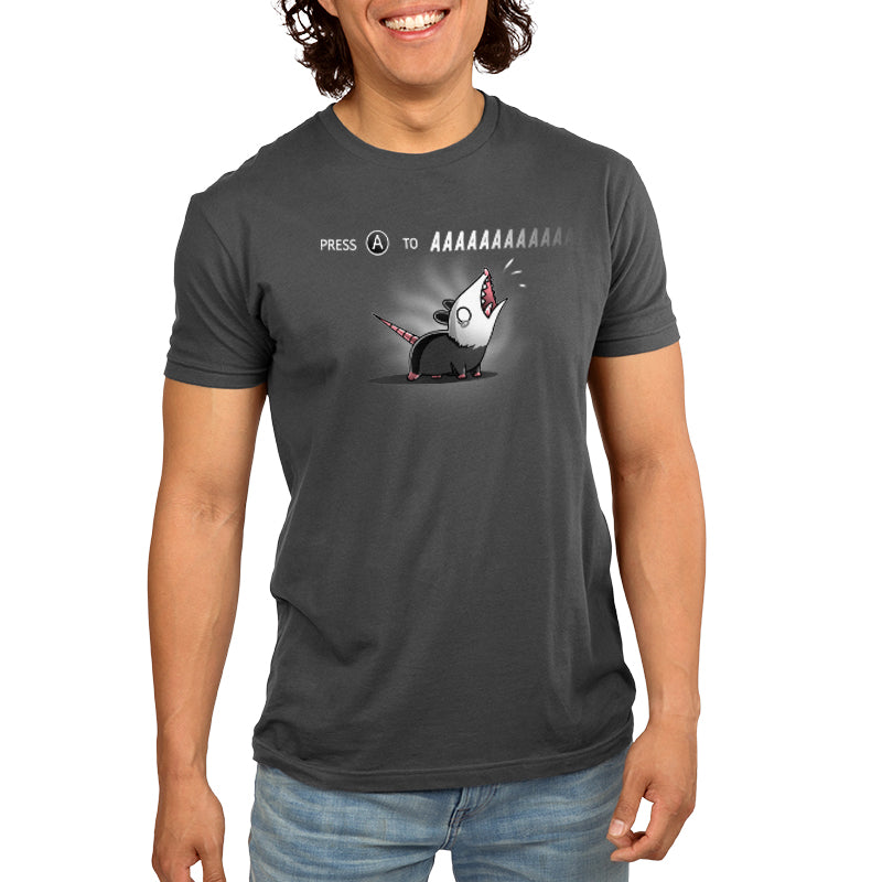A man wearing a TeeTurtle T-shirt with the Press A to AAAAAAA mouse on it.