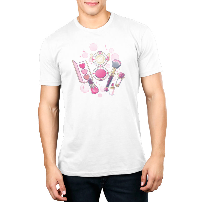 Premium Cotton T-shirt_TeeTurtle Pretty in Pink white t-shirt featuring an illustrated mini makeup set featuring a blush brush, compact mirror, eyeshadow palette, lipstick, and nail polish, all surrounded by decorative pink sparkles and hearts in a magical set. 