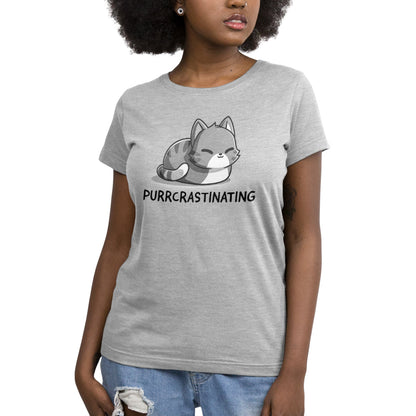 A woman wearing a silver t-shirt that says TeeTurtle Purrcrastinating.