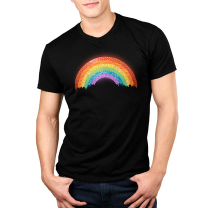 A man wearing a black Radical Rainbow T-shirt with a nature-inspired collage on it. (Brand: TeeTurtle)