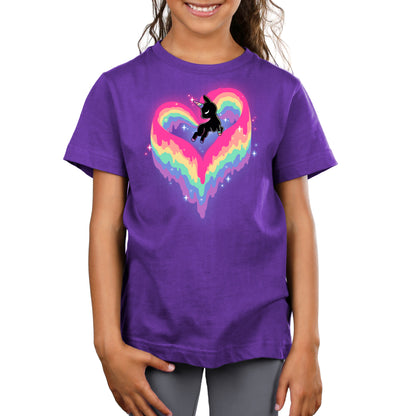 A TeeTurtle enthusiast sporting a purple t-shirt with the Rainbow Paint Unicorn design.