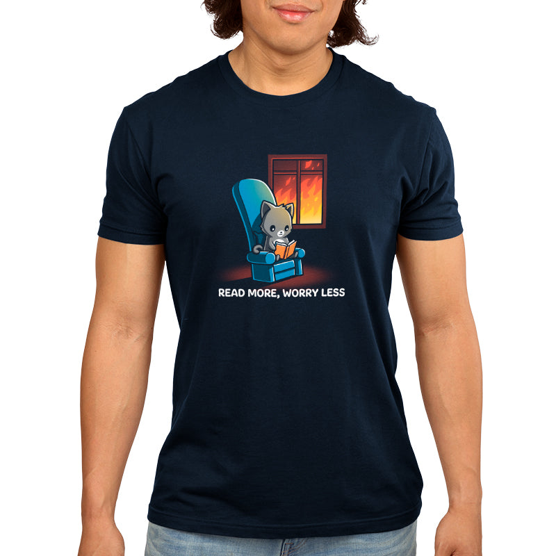 A man in a chair wearing a TeeTurtle T-shirt that reads, 'Read More, Worry Less'.