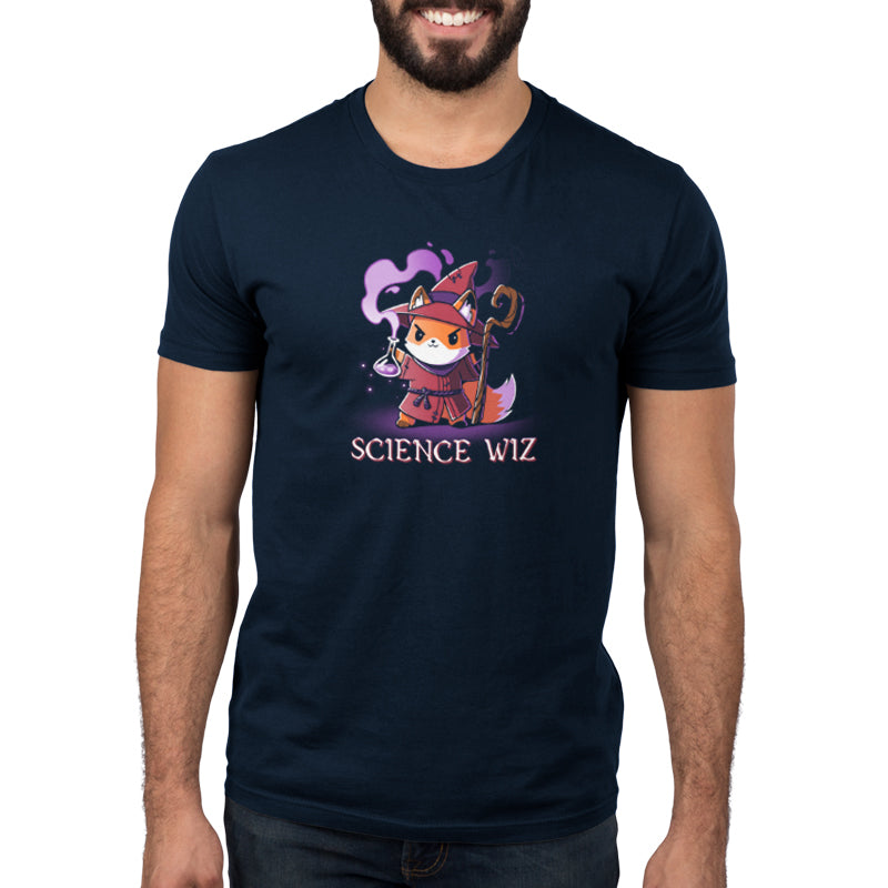 A person wearing a super soft ringspun cotton navy blue t-shirt, branded by monsterdigital, featuring a cartoon fox dressed as a wizard, holding a staff and a flask, with the text "Science Wiz" below the illustration.