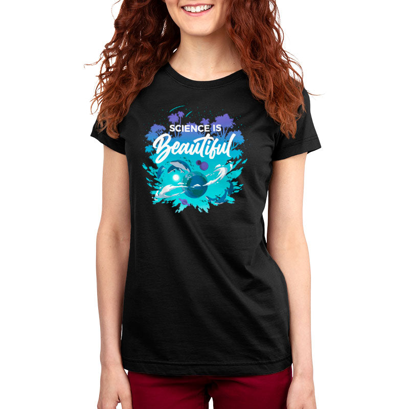 A person with curly red hair is wearing a black t-shirt made from super soft ringspun cotton, featuring the text "Science is Beautiful" by monsterdigital alongside an illustration of scientific imagery.