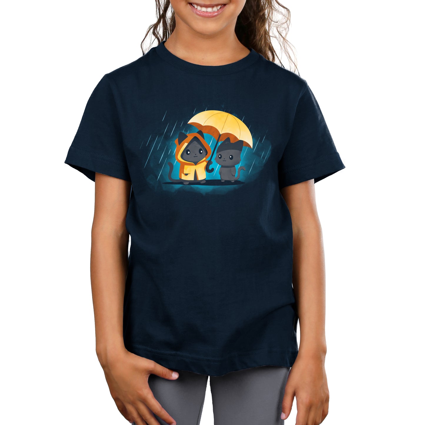 Child wearing a navy blue unisex tee made from 100% super soft ringspun cotton, featuring a graphic of two cartoon puppies under a yellow umbrella in the rain, named "Sharing Kindness" by monsterdigital.