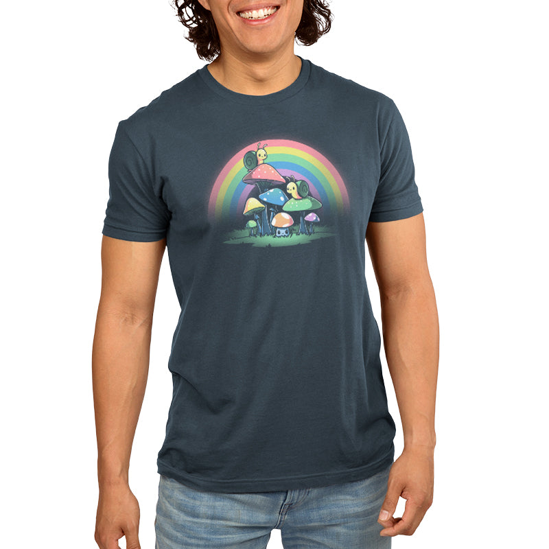 A man wearing a Snails and Mushrooms denim blue t-shirt with a rainbow on it by TeeTurtle.