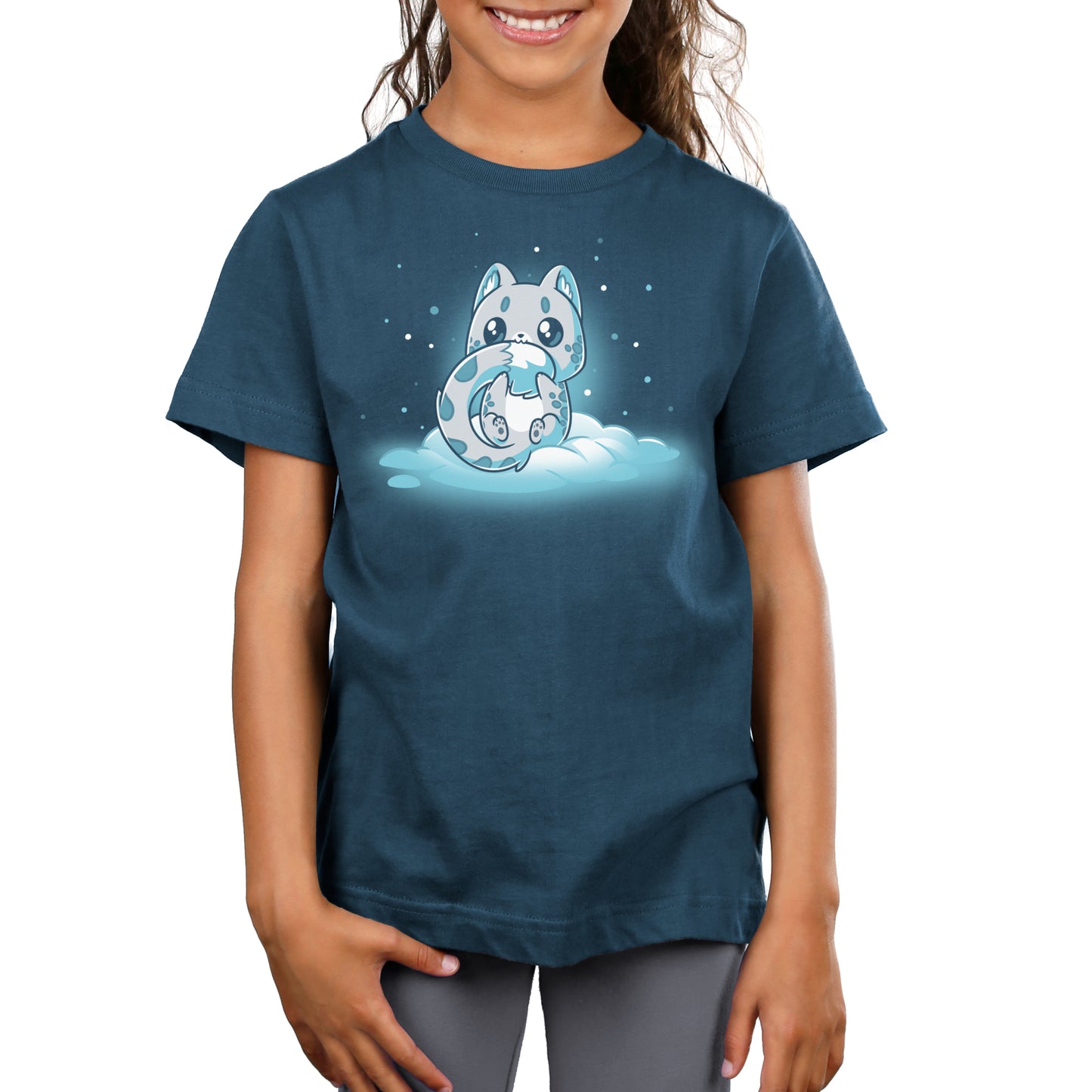 A girl wearing a Snuggly Snow Leopard t-shirt with an image of a fox in the snow, made by TeeTurtle.