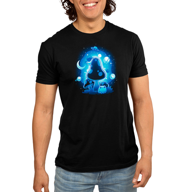 A man wearing a black t-shirt with So Mushroom in Space designs from TeeTurtle.