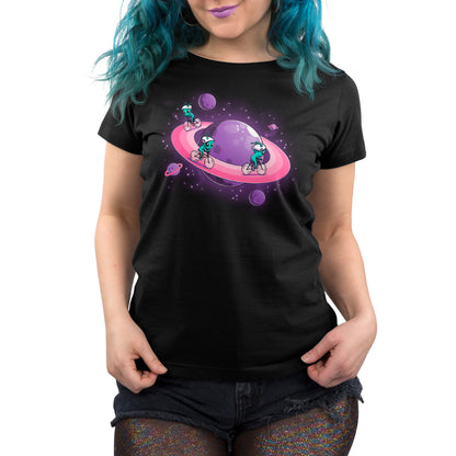 Woman wearing a TeeTurtle Space Race t-shirt, made of super soft ringspun cotton, in black with a colorful space-themed graphic design.