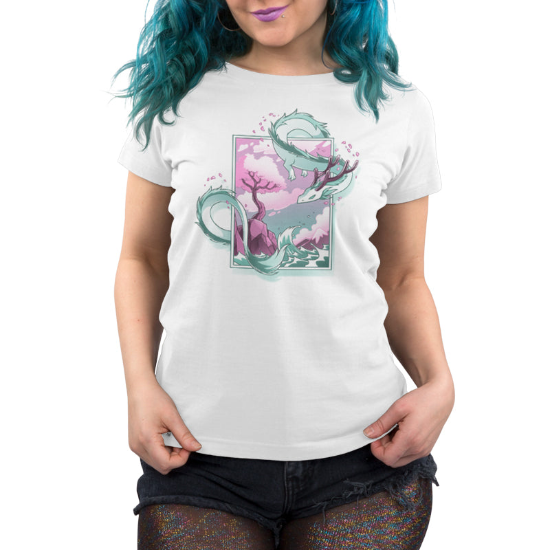 Premium Cotton T-shirt - Person wearing a monsterdigital Spring Blossom Dragon apparel featuring a sakura design of a mystical dragon and tree in pastel colors, paired with black shorts. The apparelis crafted from super soft ringspun cotton, making it as comfortable as it is stylish.