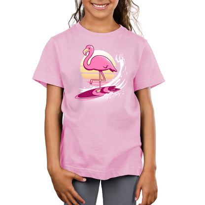 A girl wearing a Surfing Flamingo t-shirt from TeeTurtle.