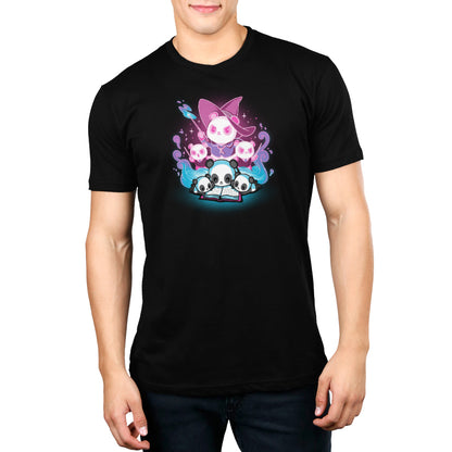 A man wearing a black t-shirt with the TeeTurtle Tales of Magic original cartoon character on it in a magical world.