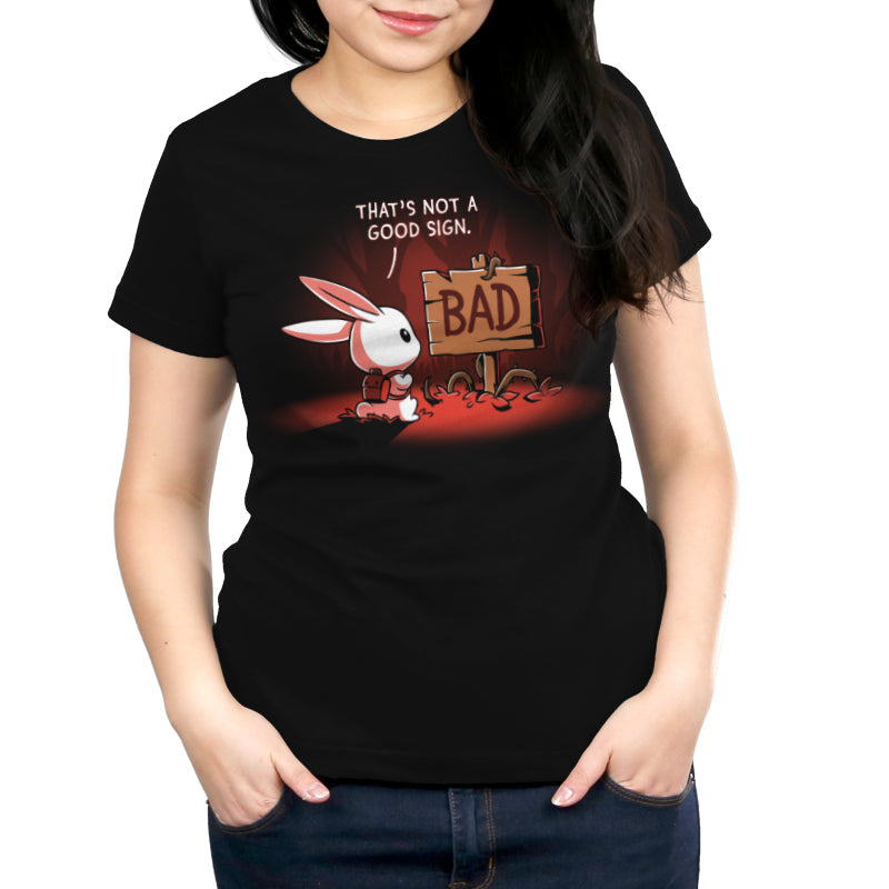 A woman carefully turning around in a black t-shirt with a bunny design (That's Not a Good Sign by TeeTurtle).