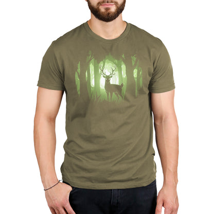 A man wearing a green Tranquil Forest t-shirt by TeeTurtle in the tranquil forest.