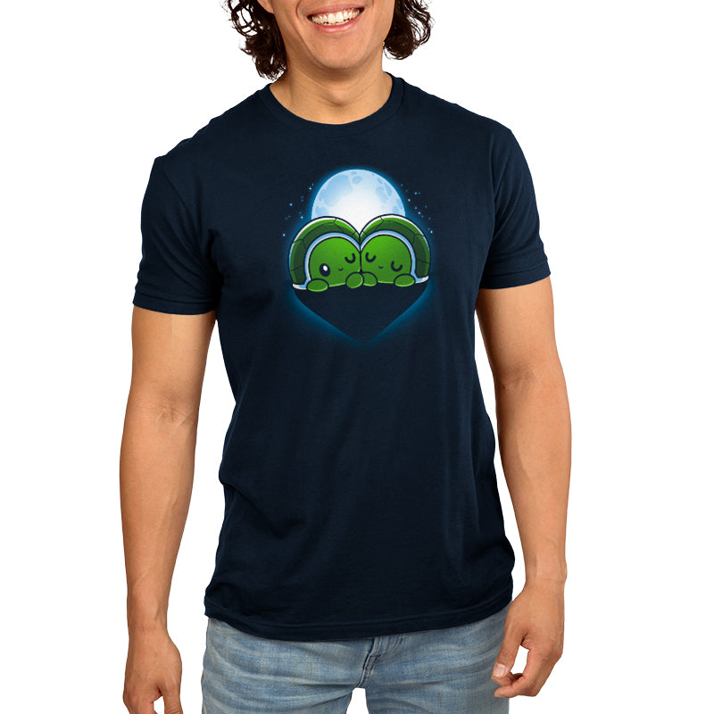 A man donning a comfortable Turtlelly in Love t-shirt made of ringspun cotton with an image of a green turtle and a moon by TeeTurtle.