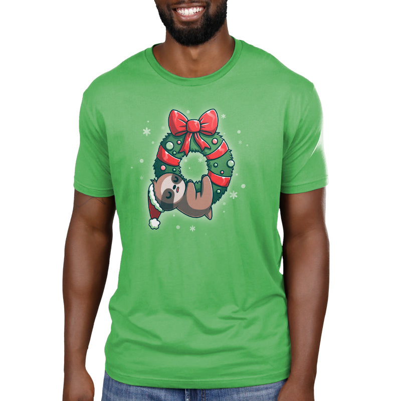 A green TeeTurtle "We Wish You a Lazy Christmas" t-shirt with a sloth wearing a Christmas wreath.