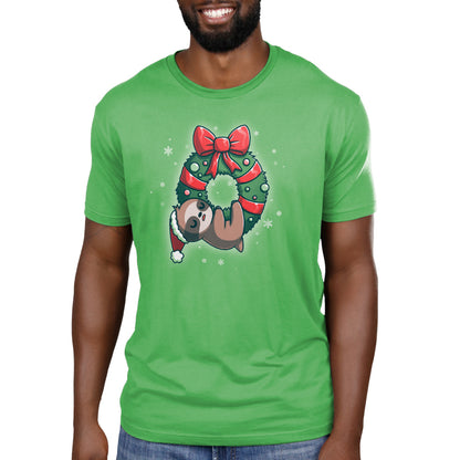 A green TeeTurtle "We Wish You a Lazy Christmas" t-shirt with a sloth wearing a Christmas wreath.