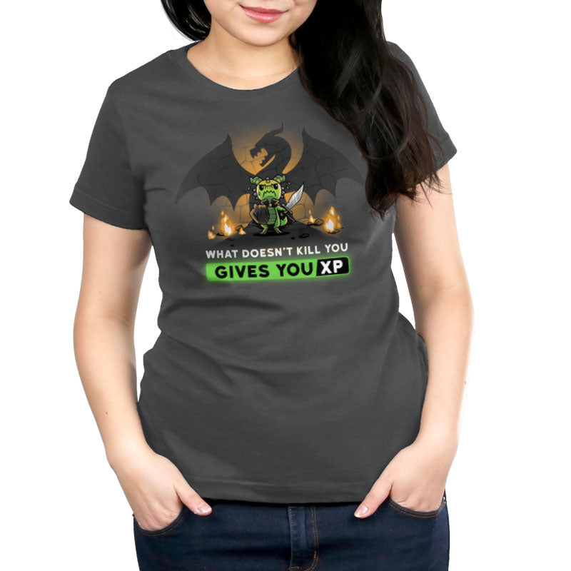 A woman wearing a charcoal gray t-shirt with the "What Doesn't Kill You Gives You XP (Dragon)" design by TeeTurtle.