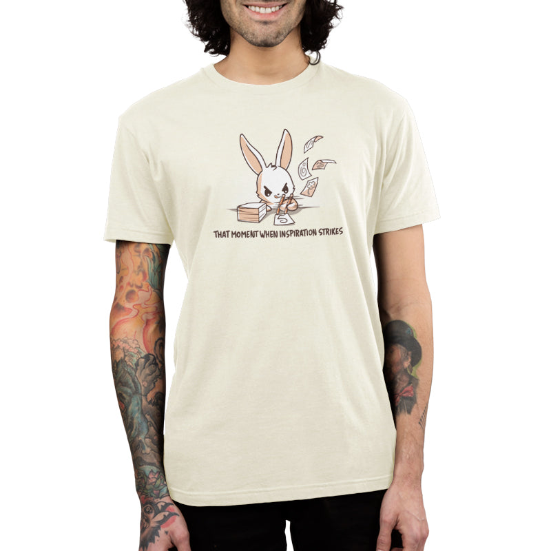 A man wearing a TeeTurtle t-shirt featuring a rabbit—When Inspiration Strikes—a comfortable and inspiring choice.