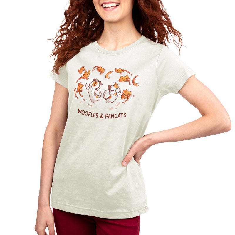 A woman wearing a Woofles & Pancats T-shirt with the brand TeeTurtle on it.