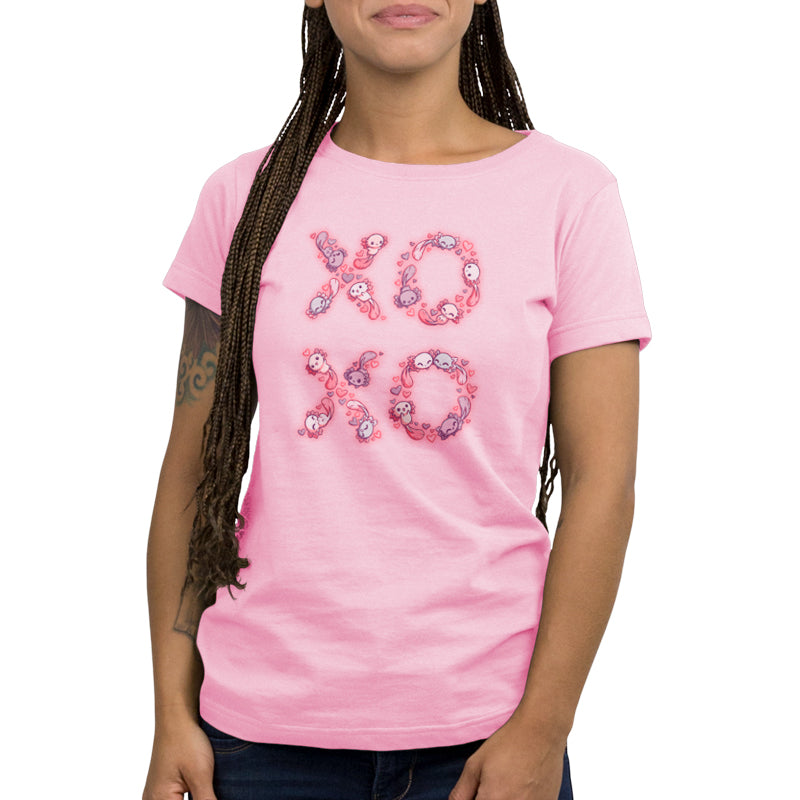 A woman wearing a pink TeeTurtle t-shirt made of Ringspun Cotton with the word "Axolotls" on it.