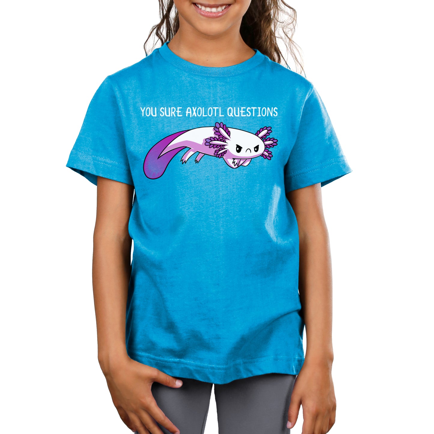 A young girl wearing a cobalt blue t-shirt from TeeTurtle that says You Sure Axolotl Questions, featuring the TeeTurtle original design.