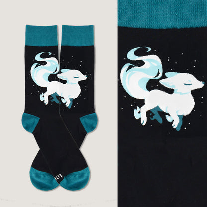 A comfortable pair of TeeTurtle Ethereal Fox Socks with a white fox on them.