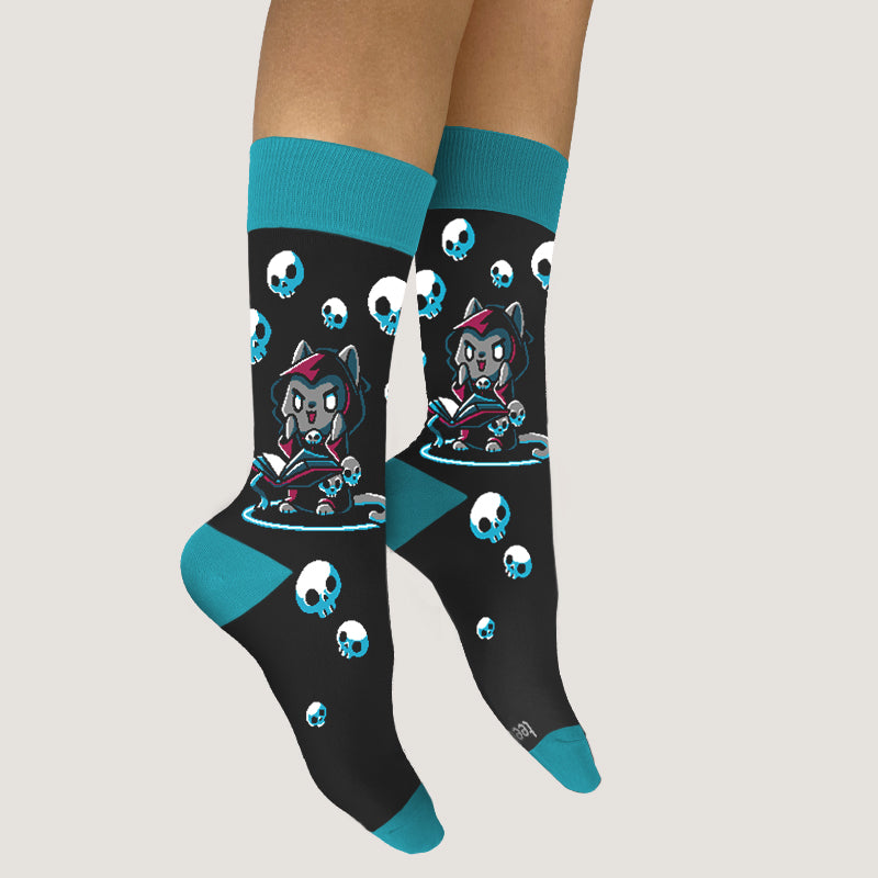 A woman wearing TeeTurtle Necromancer Kitty Socks.