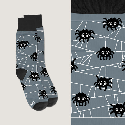 A pair of Spooky Spider Socks by TeeTurtle, perfect for arachnid enthusiasts or adding a touch of creepiness to your sock drawer.